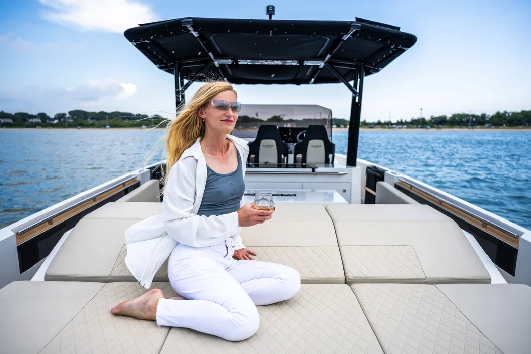Guest relaxing on private yacht near Delray shoreline view.