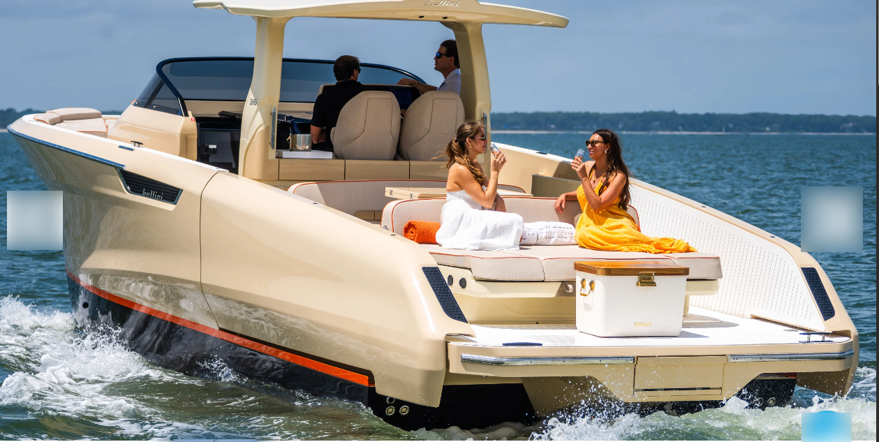 Luxury yacht glides across calm water with relaxed passengers.