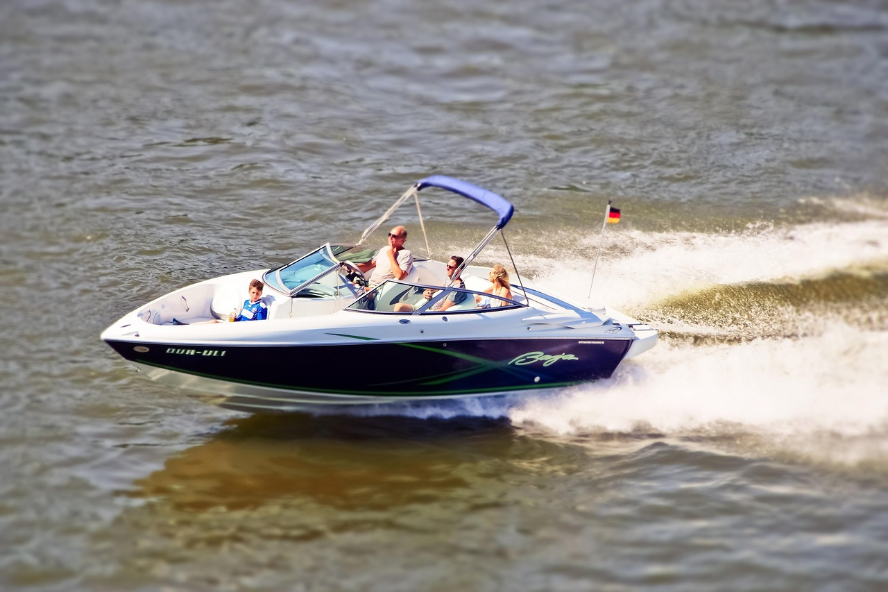 Bowrider speedboat Baja cruising with family under sunny sky.