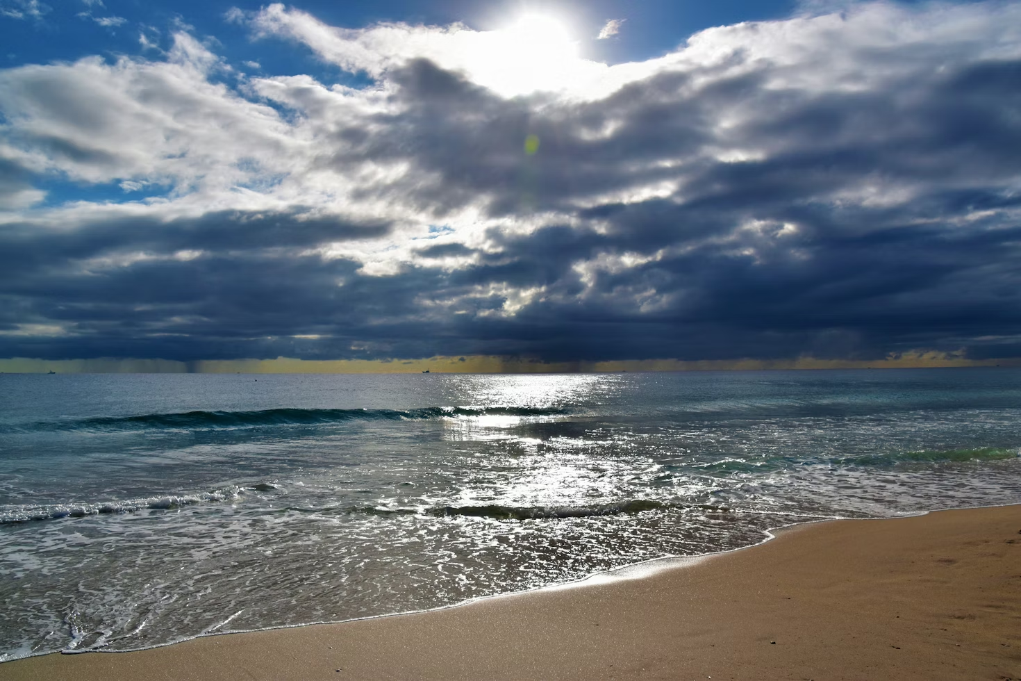 Delray Beach Intracoastal with waves, clouds, and sunlight reflections.