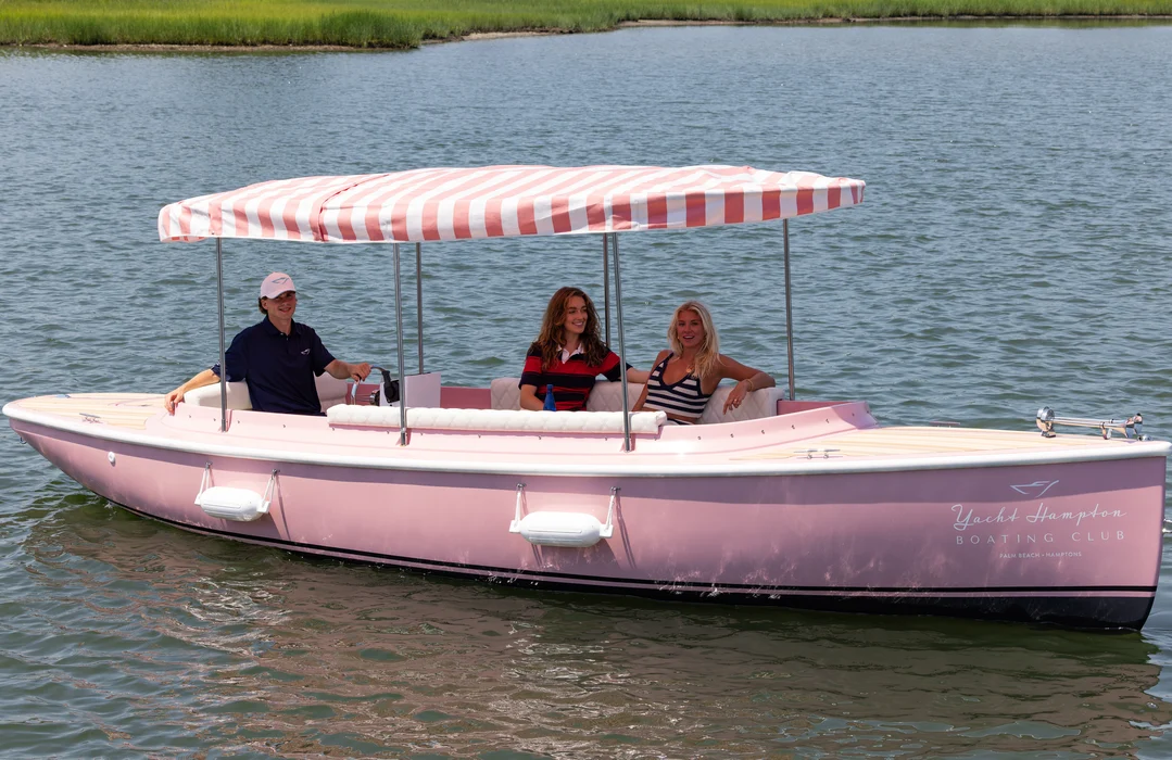Delray Beach pastel rental boat cruising calm tropical waters.