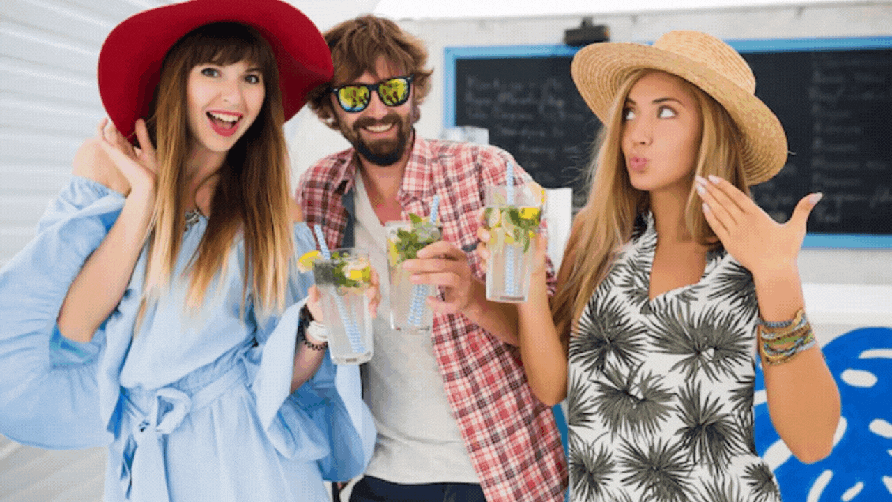 Young friends on a boat party, having fun togethe