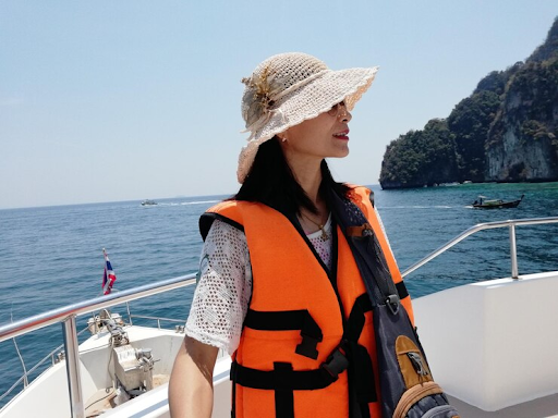 Women wearing a life jacket on a yacht