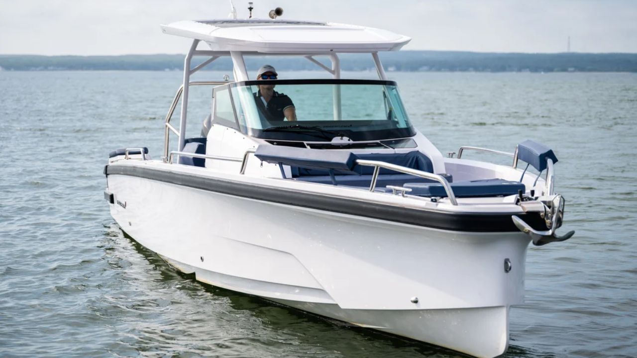 Modern motorboat cruising calm waters with canopy and seating. 