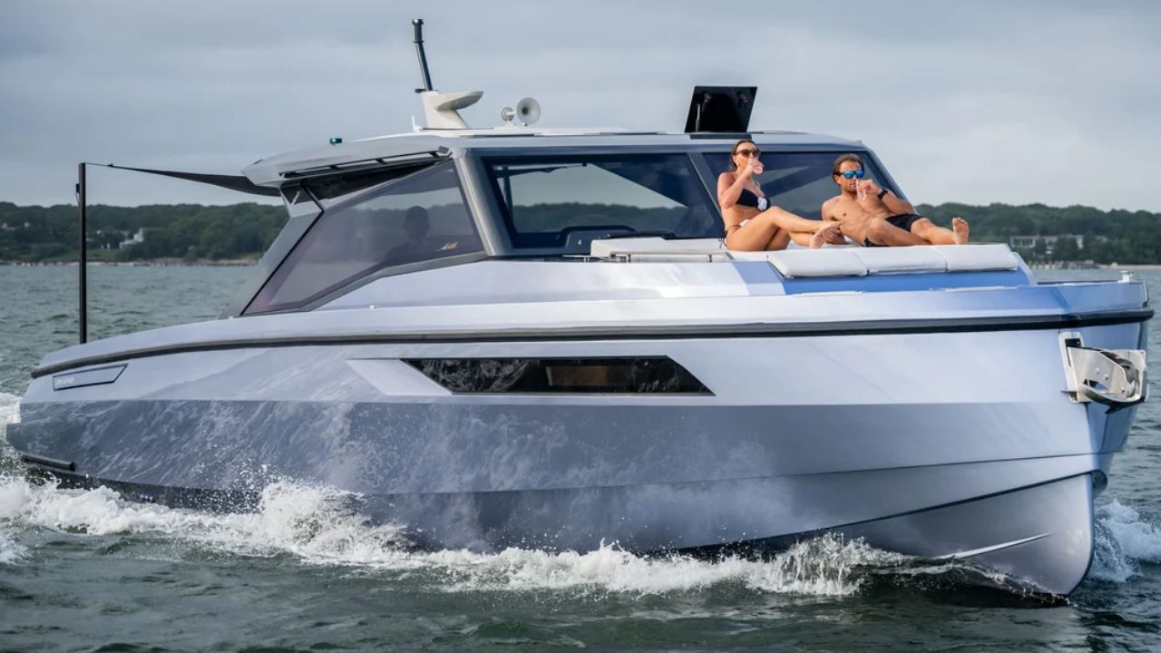 Luxury private yacht charter with passengers relaxing on deck.