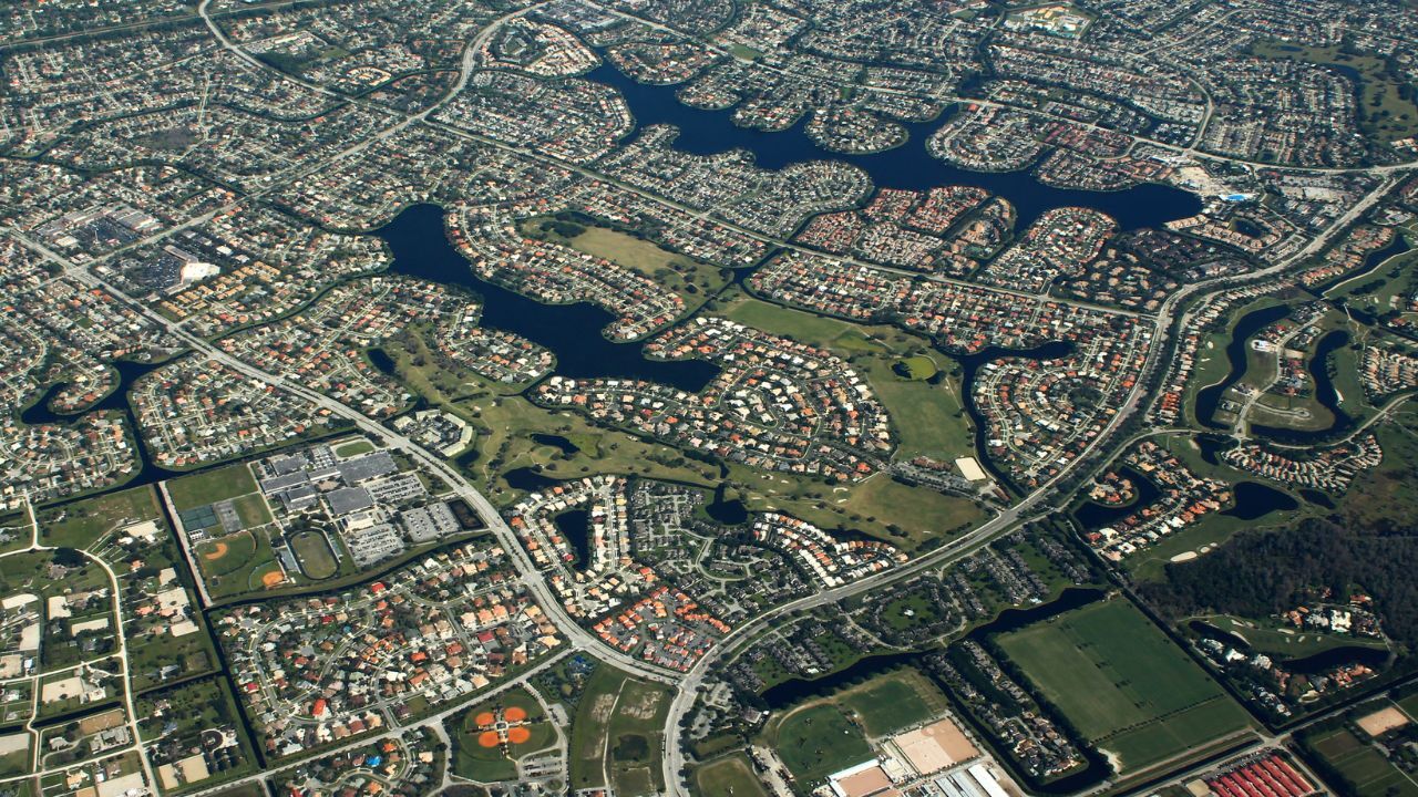 Aerial Wellington neighbourhoods surrounding lakes, golf courses, and parks 
